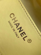 Chanel bag Made in Italy leather stamp on pale yellow interior panel.