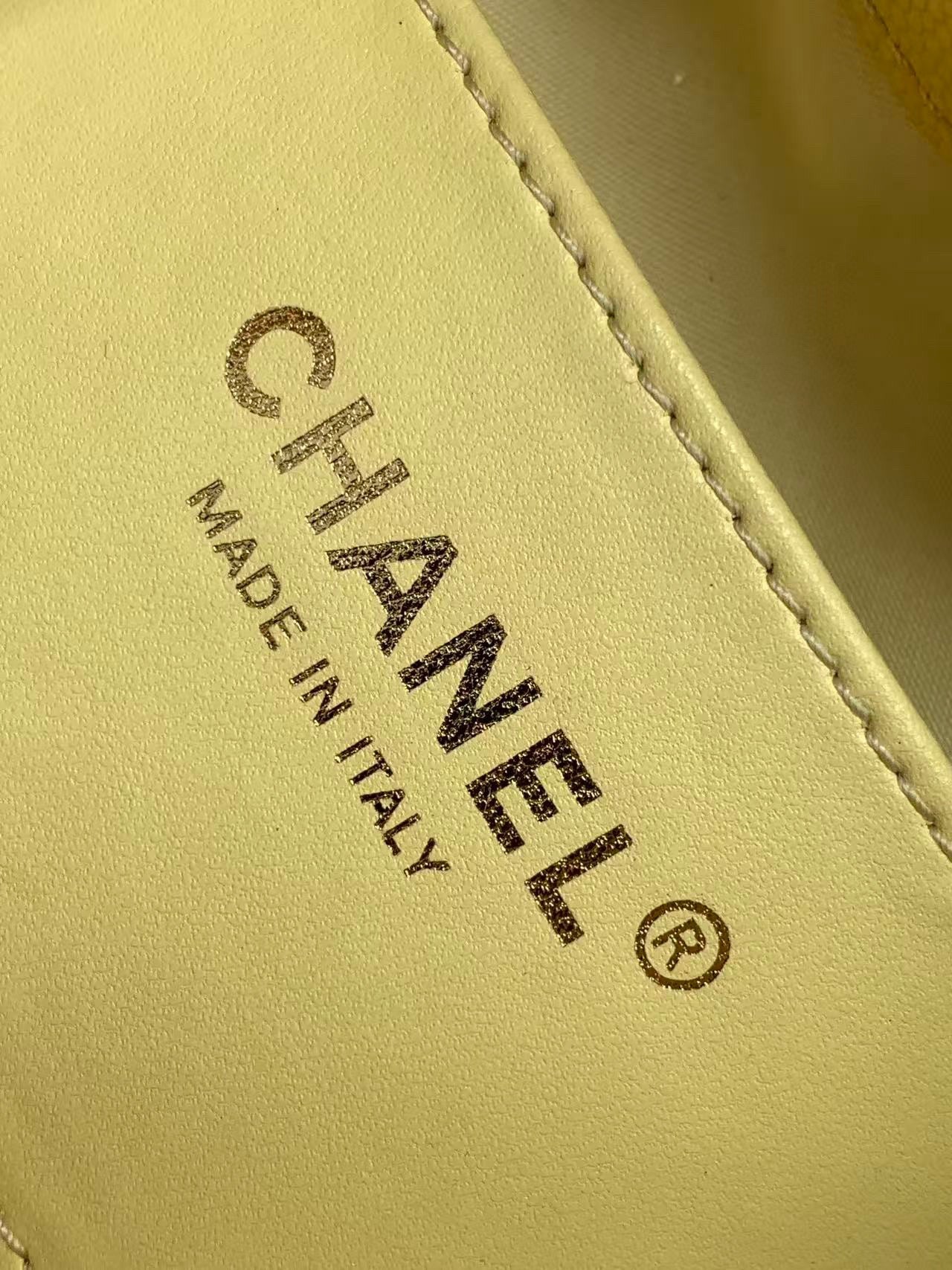 Chanel bag Made in Italy leather stamp on pale yellow interior panel.