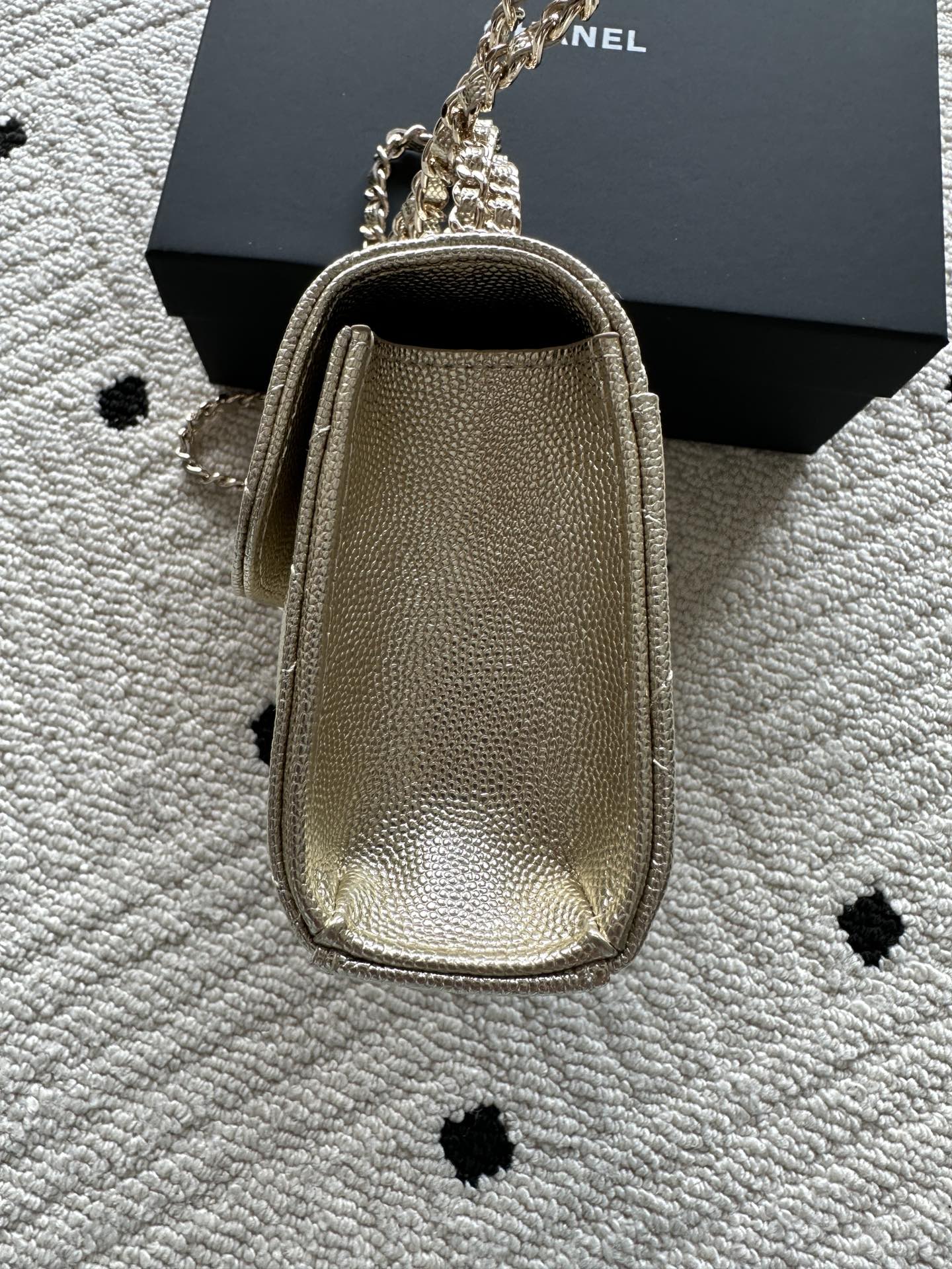 Chanel small top-handle bag in textured finish with chain strap and gold clasp