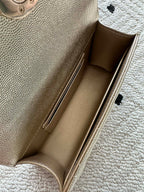 Chanel bag interior view with light lining and side wall stitching