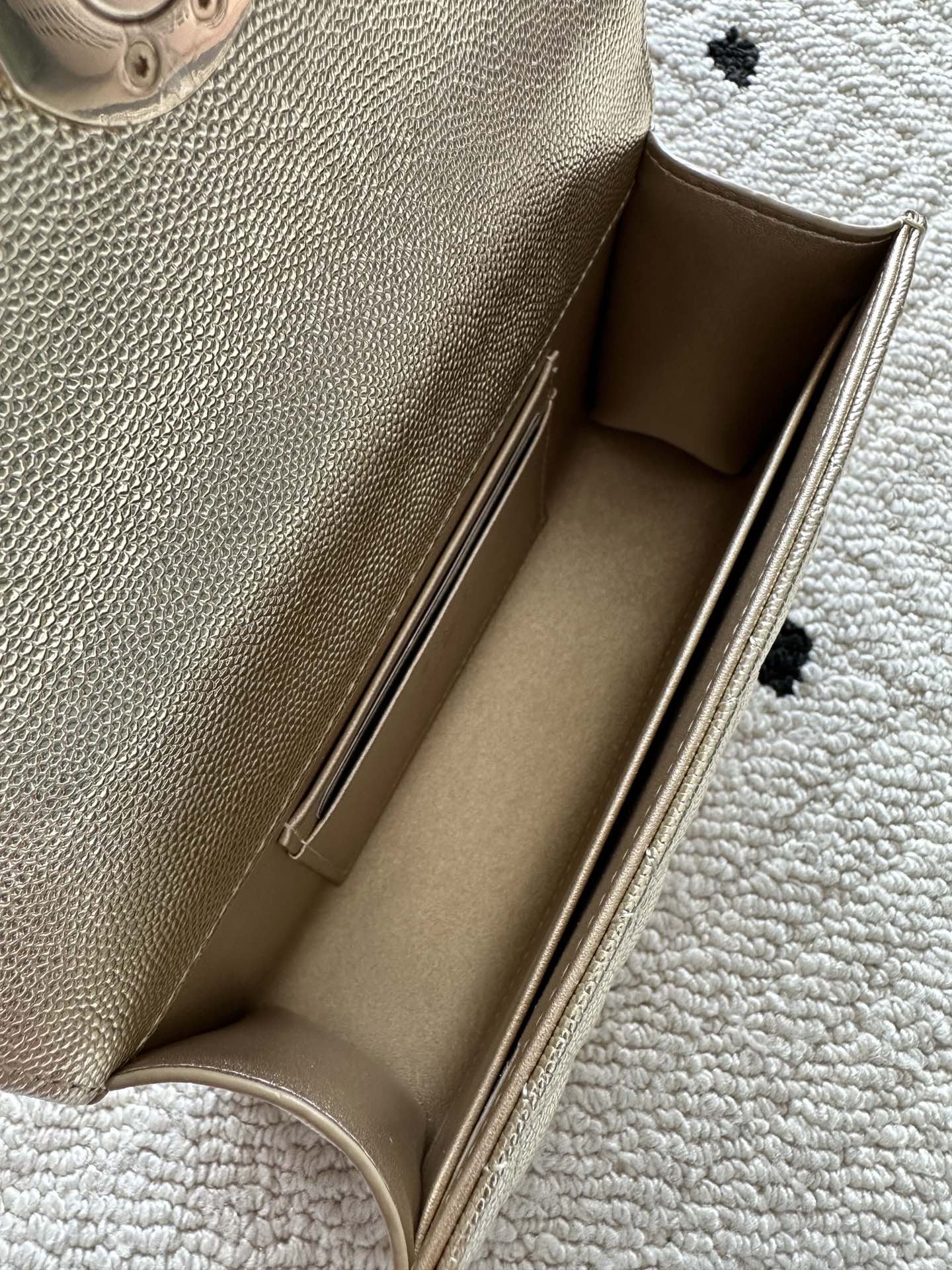 Chanel bag interior view with light lining and side wall stitching