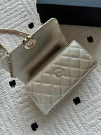 Chanel small quilted flap bag with chain strap and front snap button