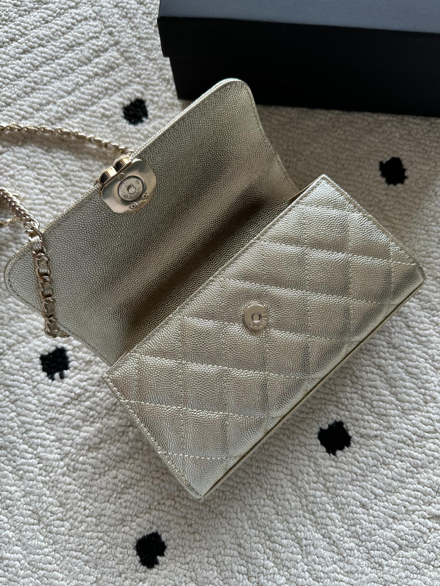 Chanel small quilted flap bag with chain strap and front snap button