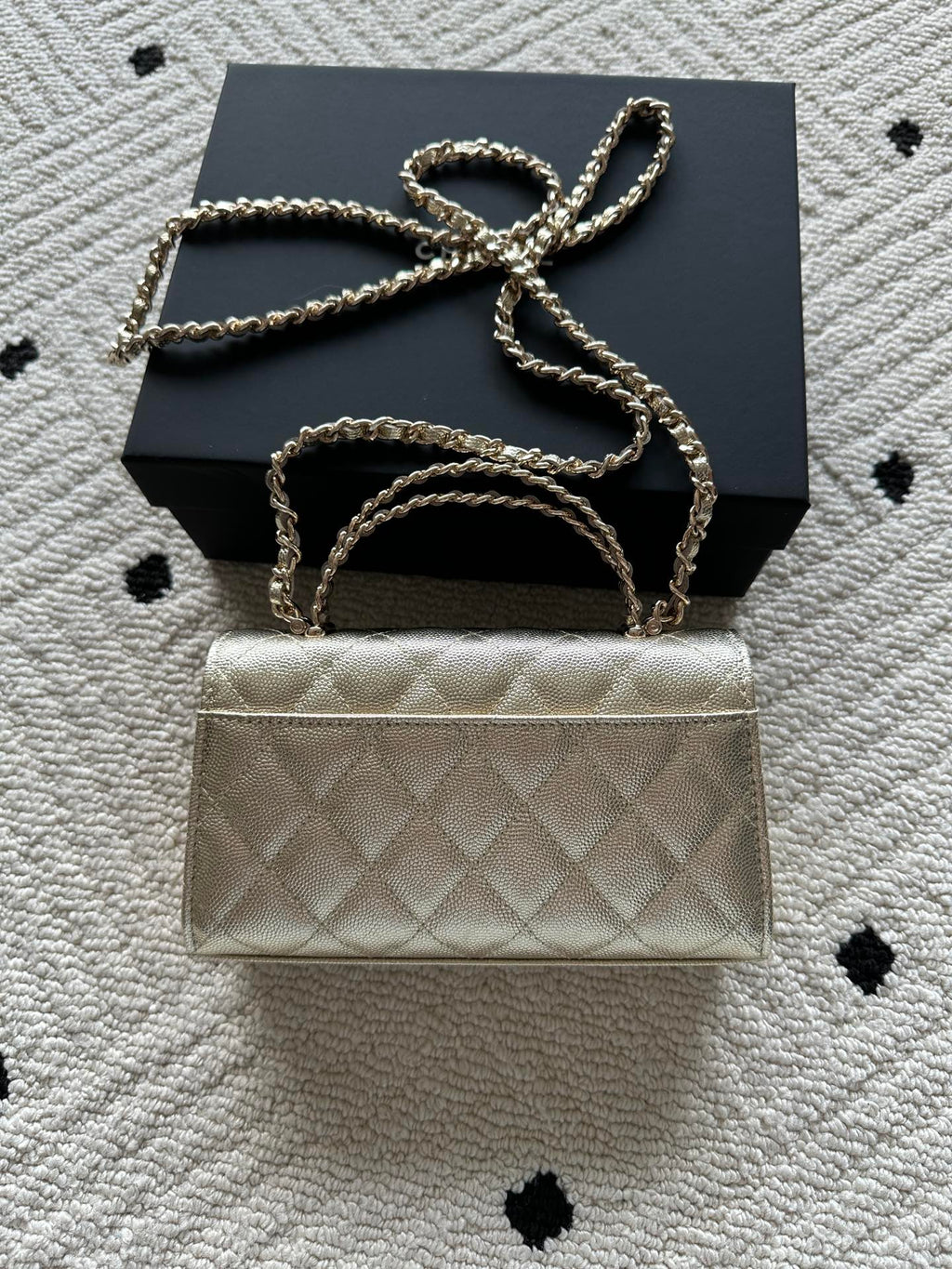 Chanel small quilted flap bag with chain strap over the top handle