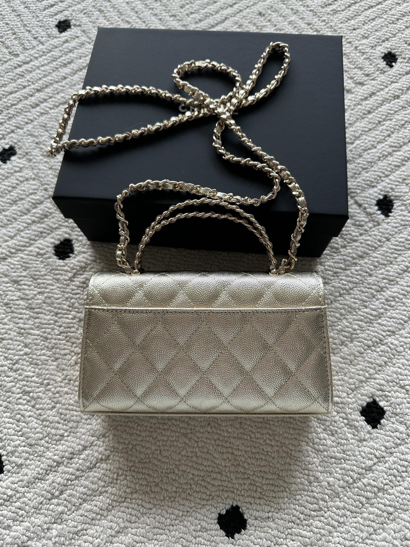 Chanel small quilted flap bag with chain strap over the top handle
