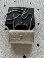Chanel small quilted flap bag with chain shoulder strap and gold-tone hardware