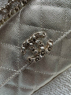 Chanel textured metallic bag close-up with chain strap and clasp hardware