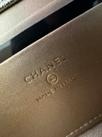 Chanel leather bag exterior close-up with embossed logo text