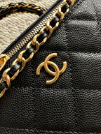 Black leather zipper pouch with gold chain detail and CC charm on front