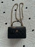 Chanel small quilted leather handbag with gold chain strap and CC front logo
