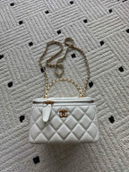 White quilted mini handbag with gold chain strap and CC clasp hardware