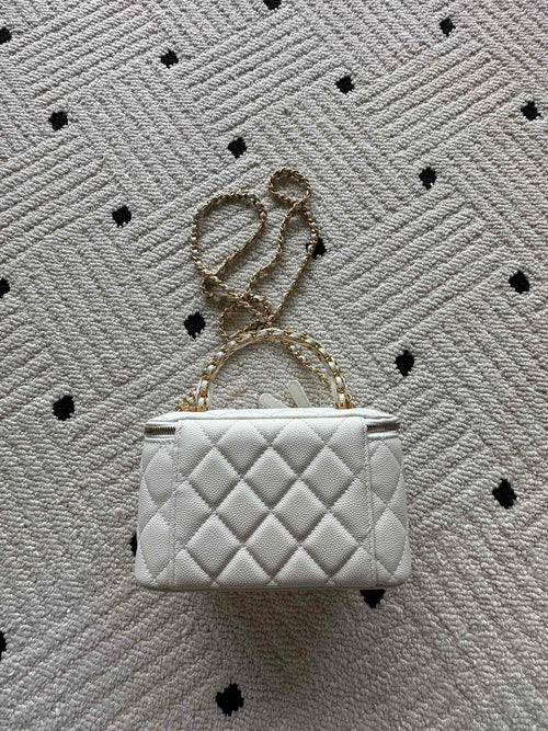 White quilted mini handbag with gold chain strap and CC hardware, front view
