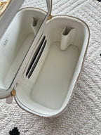 White zip mini handbag open with card slots and interior compartments