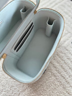 Light-blue mini bag interior with card slots and inner zipper pouch