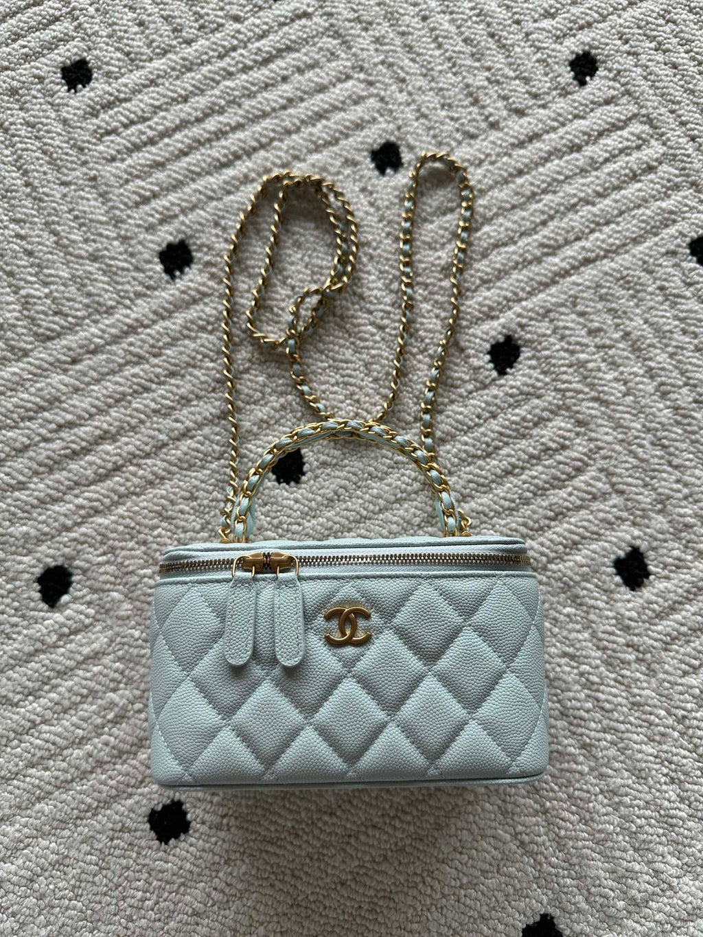 Quilted light-blue mini shoulder bag with gold chain strap and front logo turn-lock