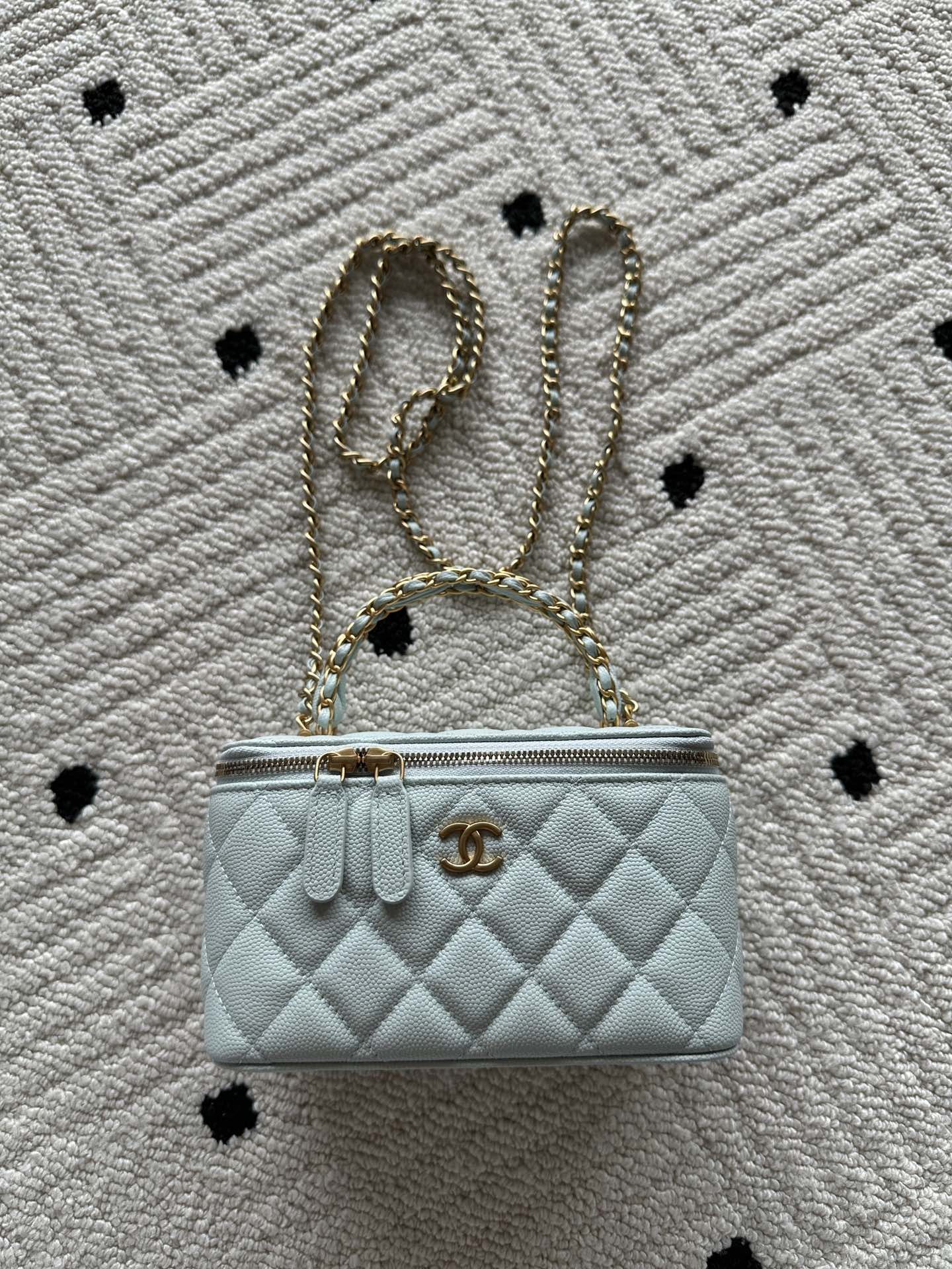 Quilted light-blue mini shoulder bag with gold chain strap and front logo turn-lock