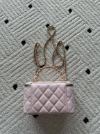 Chanel quilted mini bag in pink with gold chain and short handle