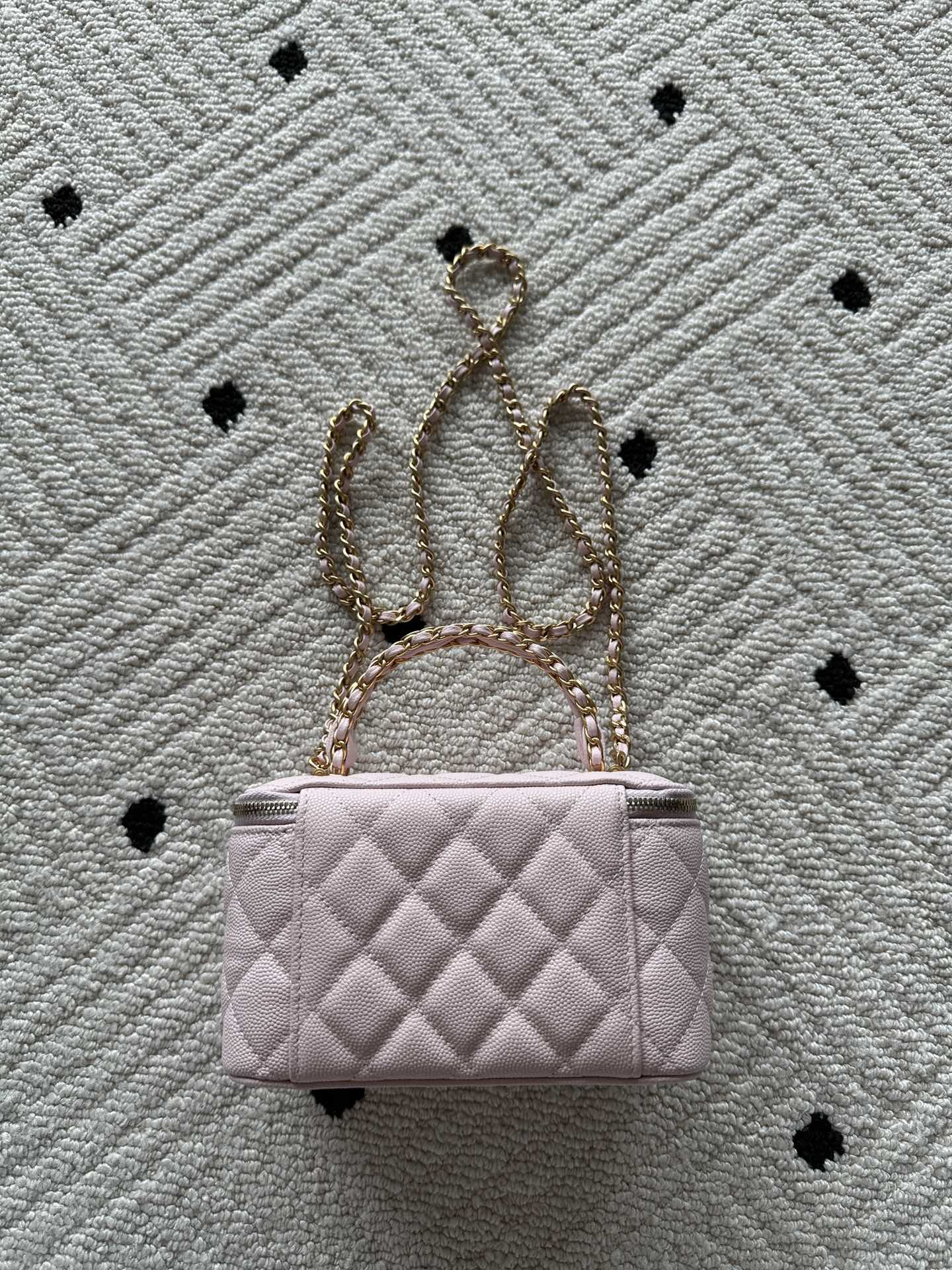 Chanel quilted mini bag in pink with gold chain and short handle