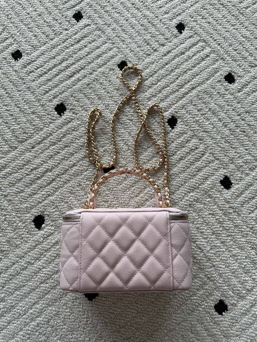 Chanel quilted mini bag in pink with gold chain and short handle