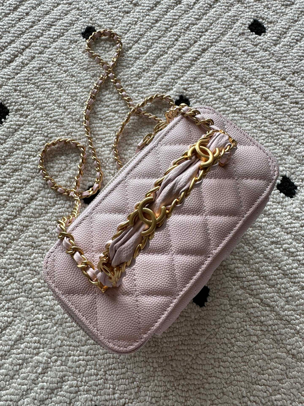 Chanel mini bag in pink with gold chain and front flap detail