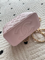 Chanel mini bag in pink with quilted pattern and gold chain strap