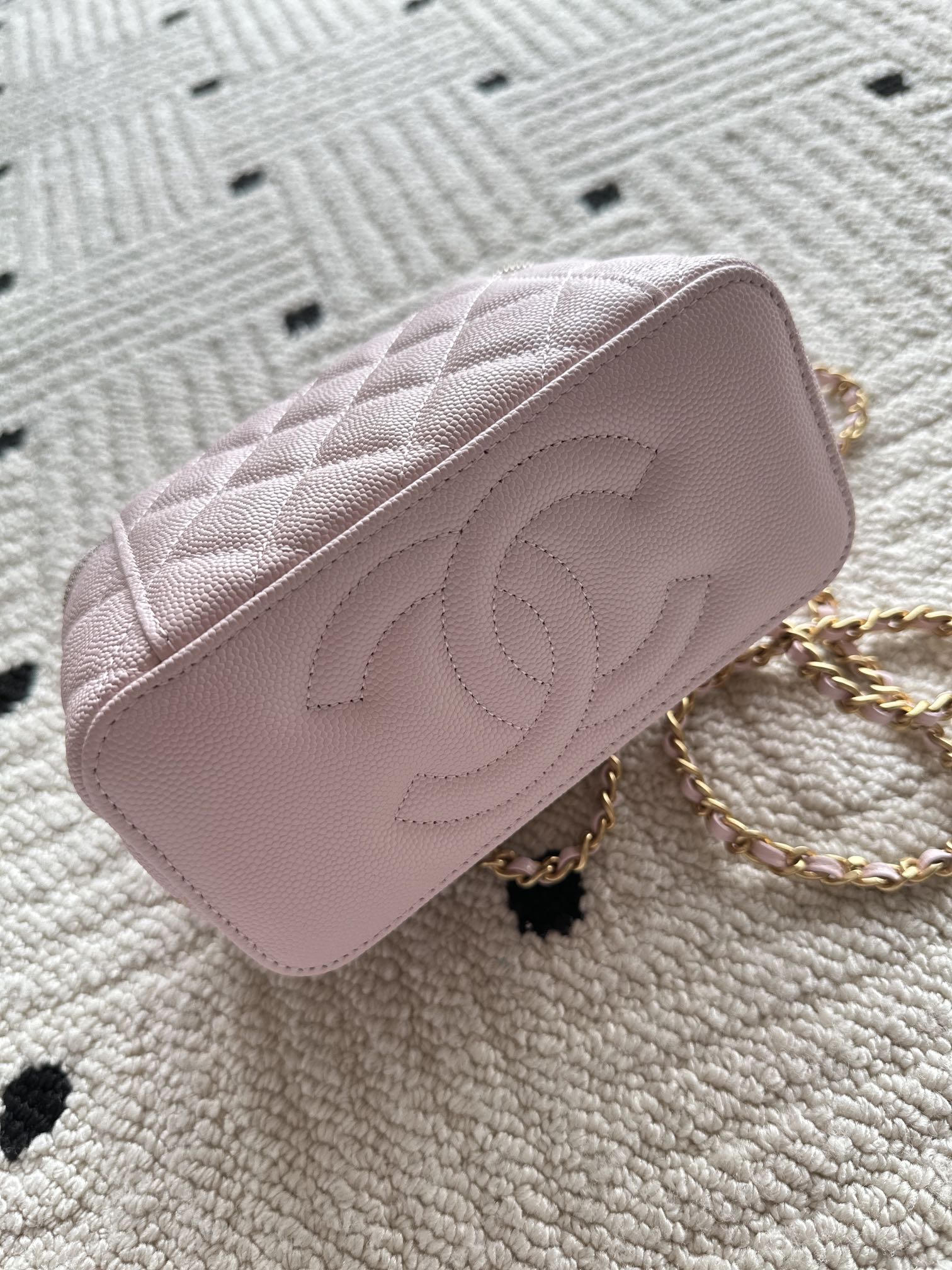 Chanel mini bag in pink with quilted pattern and gold chain strap