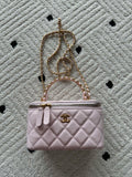 Chanel quilted mini bag in pink with chain strap and front logo