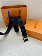 Louis Vuitton navy monogram belt with gold-tone buckle, belt ends spread out