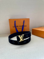 Louis Vuitton navy monogram belt featuring gold-tone LV emblem buckle