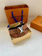 Louis Vuitton belt in box with brown monogram strap and gold-tone LV buckle