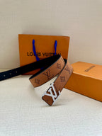 Louis Vuitton belt with tan monogram strap and gold-tone buckle, strap end detail