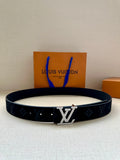 Dark blue patterned belt with silver LV logo buckle, black hardware, stud holes visible.
