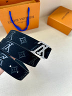 Dark blue monogram belt with silver LV buckle and black strap with stud holes.
