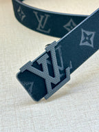 Dark blue monogram belt with large silver LV buckle; belt holes and end detail.