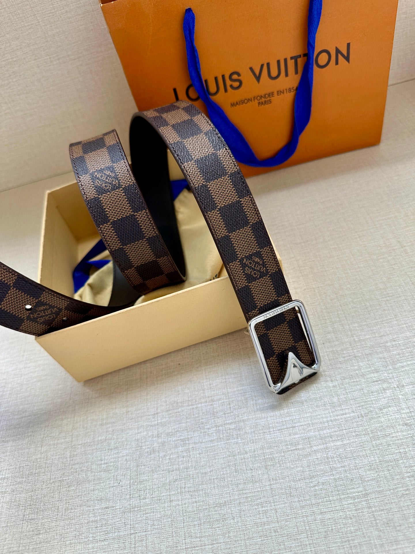Damier check canvas belt with dark leather edge and silver-toned buckle