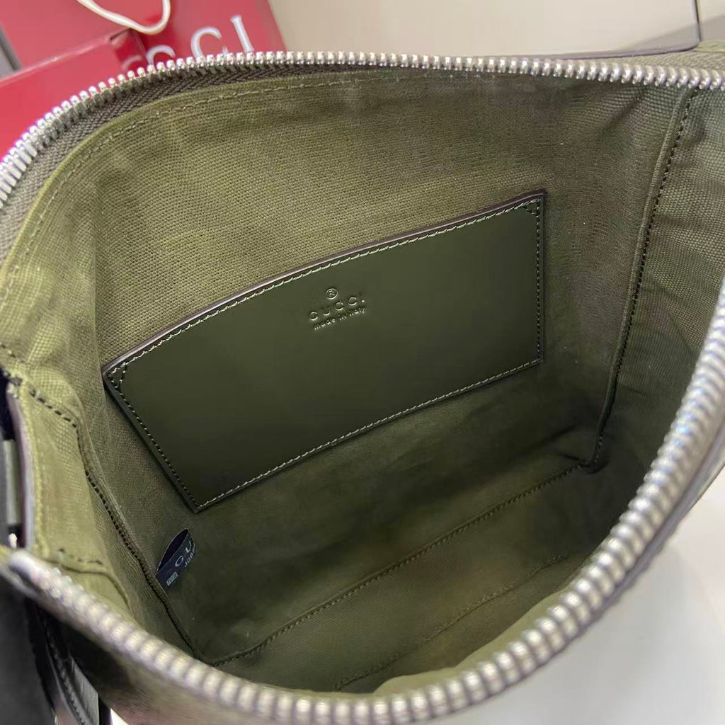 Crossbody bag interior lining with stitched leather panel and zipper top opening