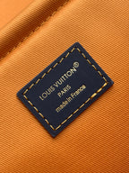 Louis Vuitton tag reading “made in France” on blue leather patch
