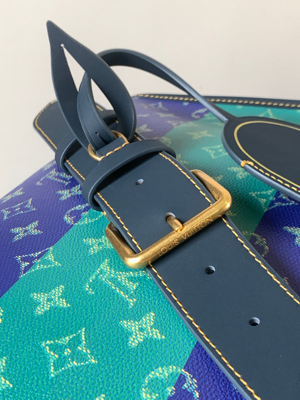 Louis Vuitton men's strap and buckle detail on multicolor monogram bag