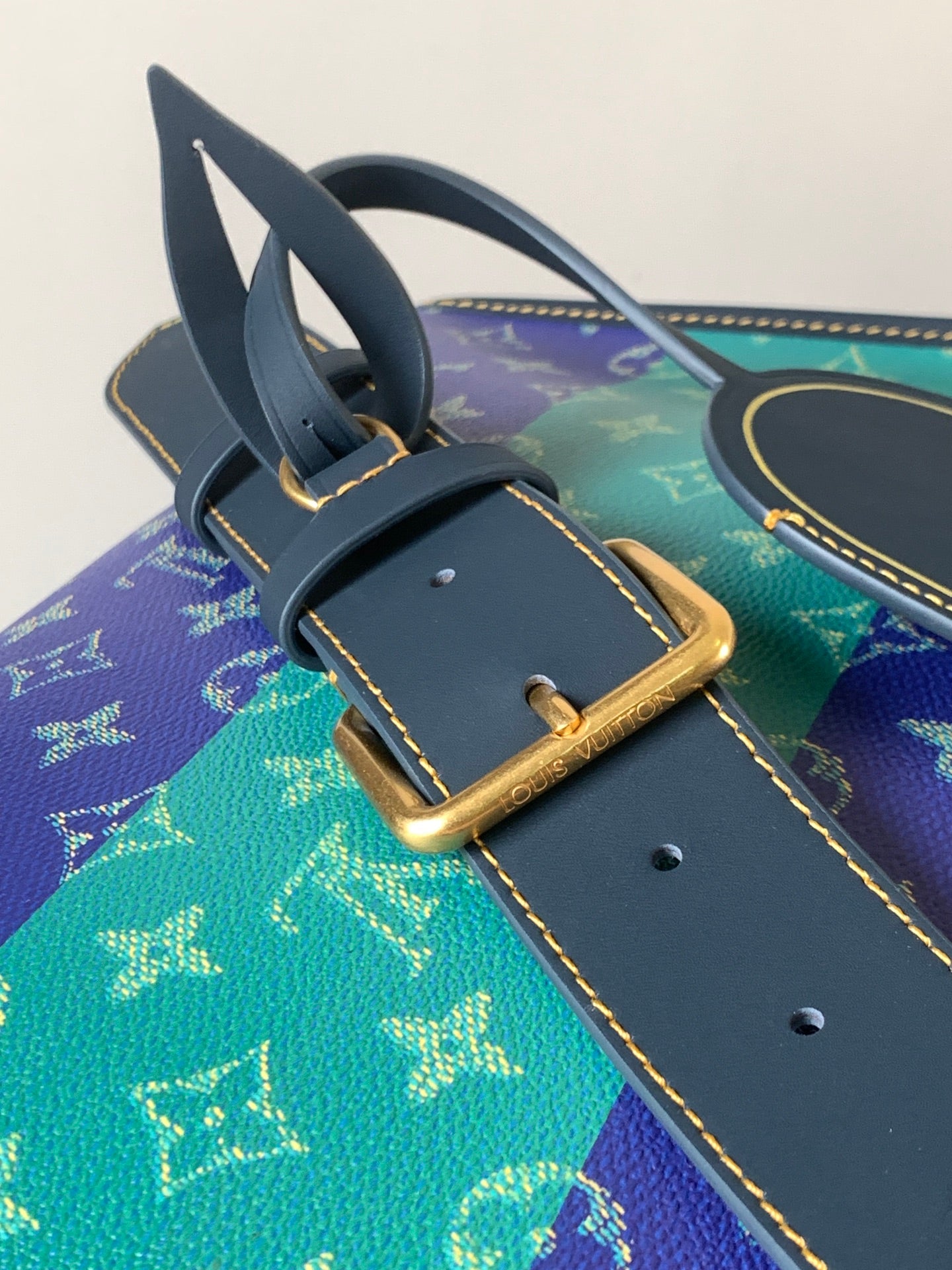 Louis Vuitton men's strap and buckle detail on multicolor monogram bag