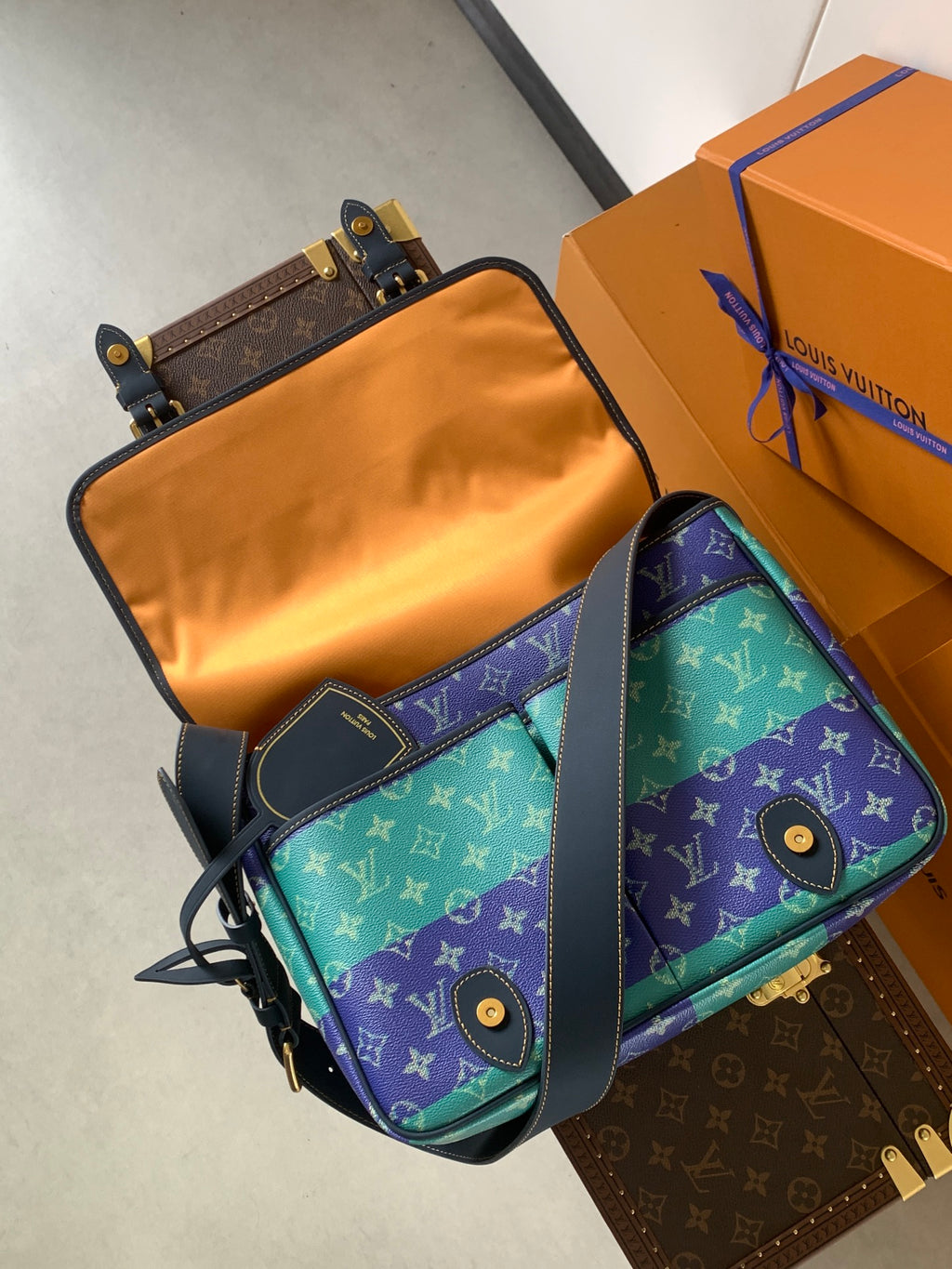 Louis Vuitton men's crossbody bag with multicolor monogram front and blue strap