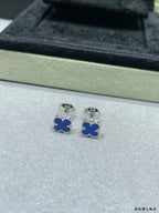 Clover enamel stud earrings with blue enamel and silver-tone posts in box