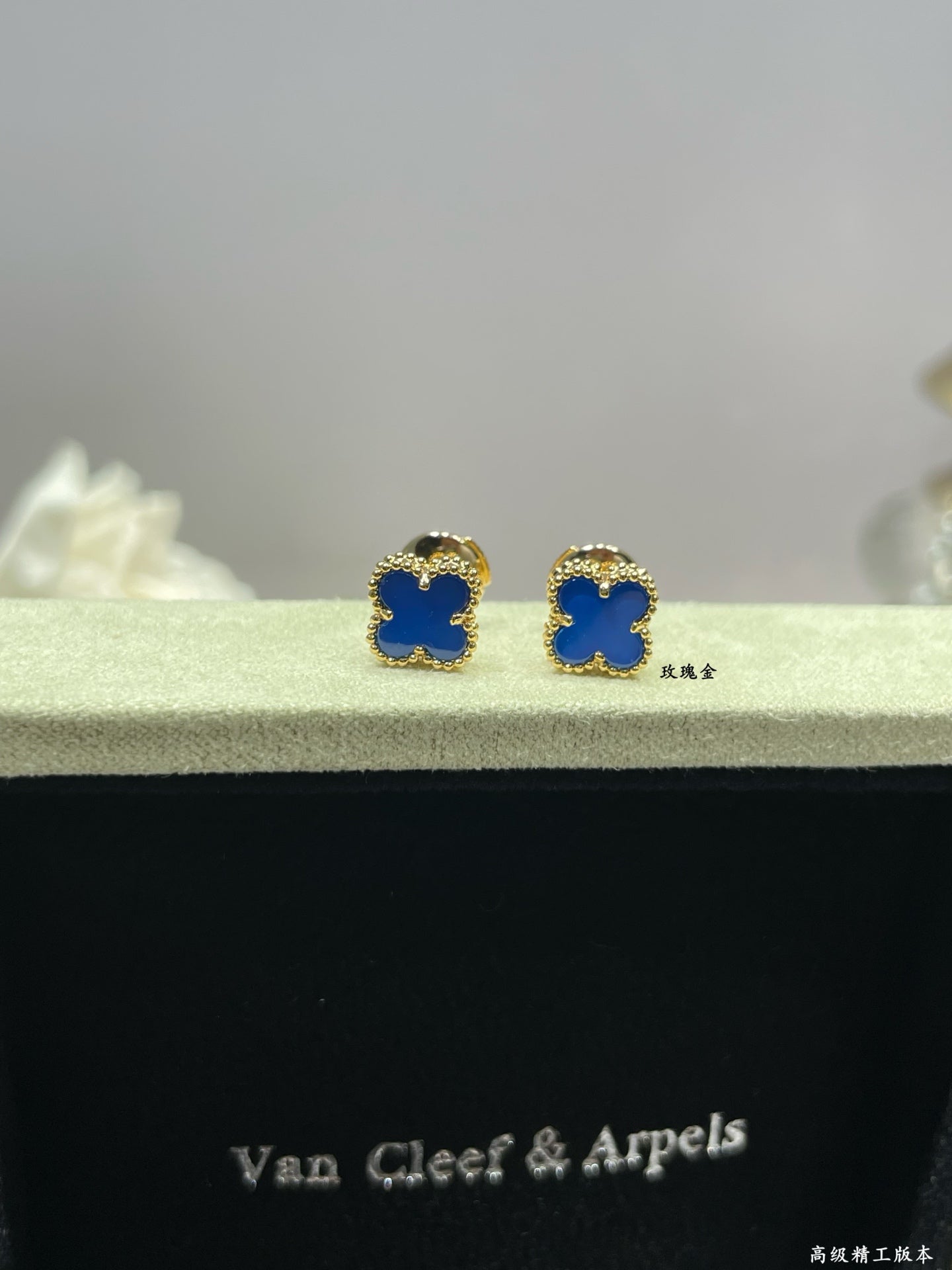 Clover enamel stud earrings with blue enamel and gold-tone settings