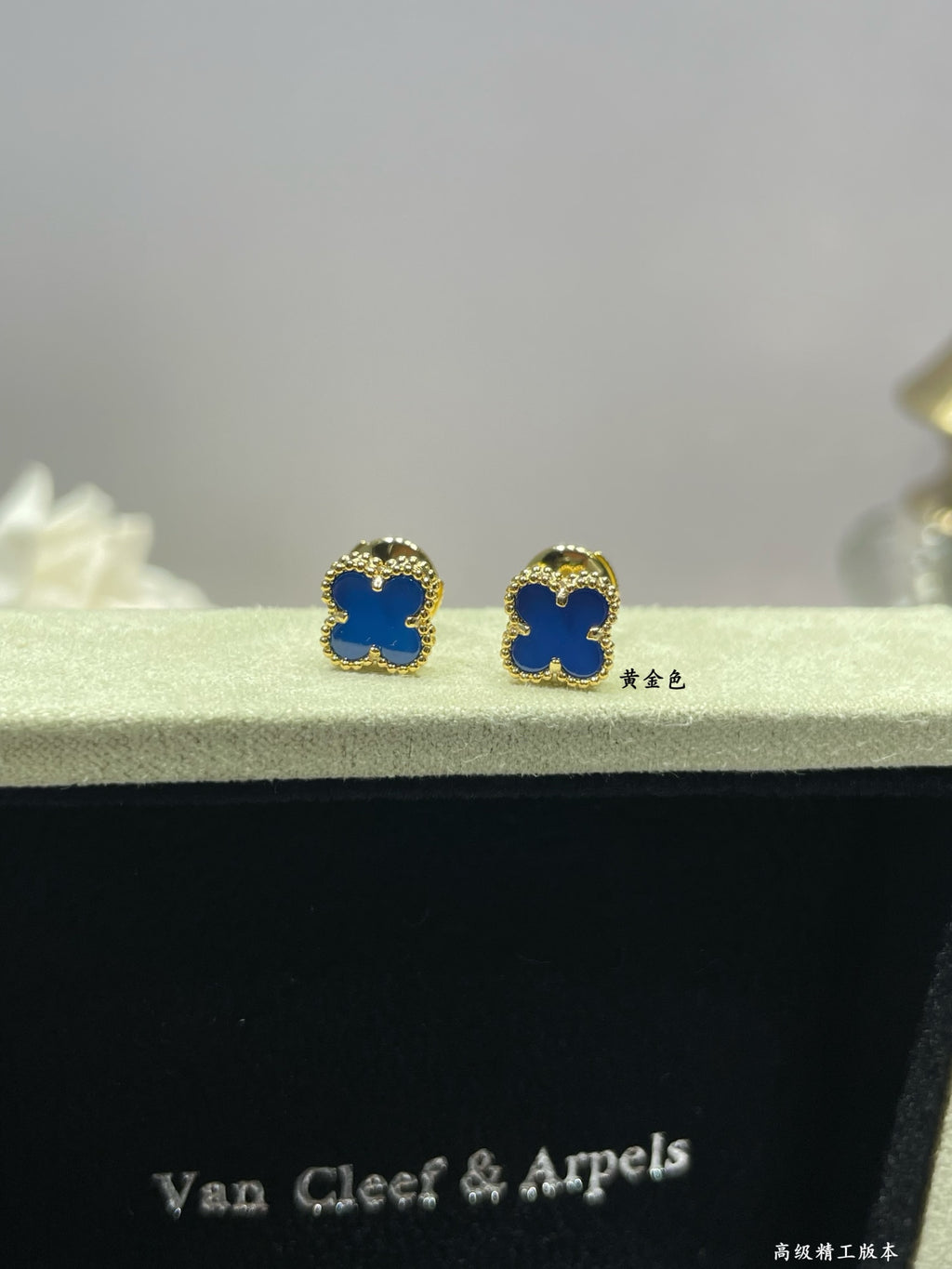 Clover enamel stud earrings with blue enamel and gold-tone settings