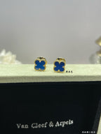 Clover enamel stud earrings with blue enamel and gold-tone settings