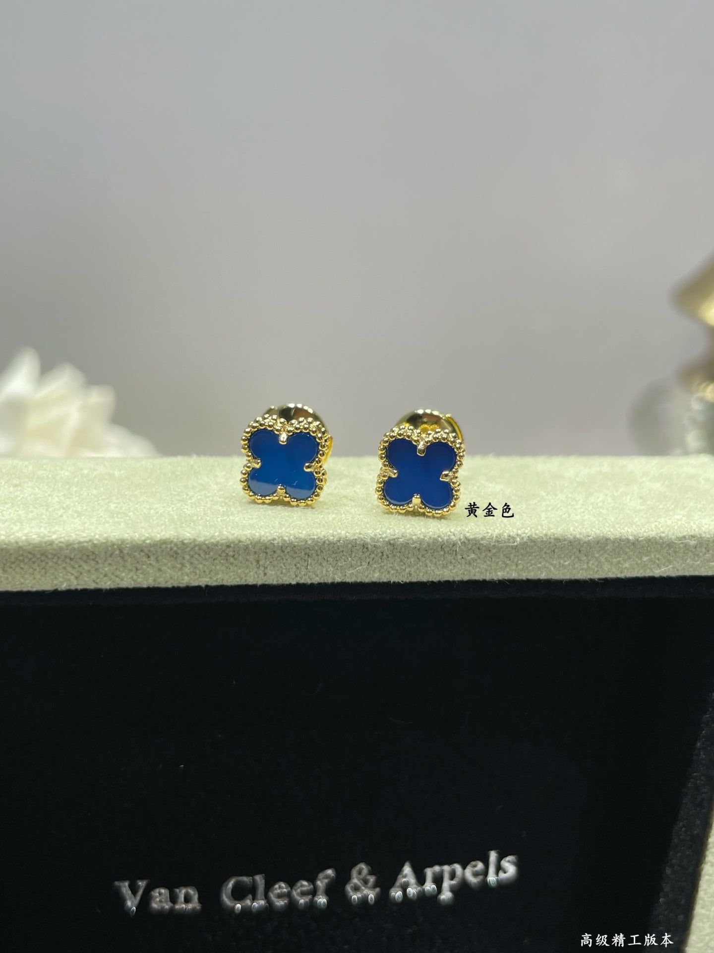 Clover enamel stud earrings with blue enamel and gold-tone settings