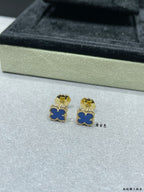 Clover enamel stud earrings with blue enamel and gold-tone posts in box