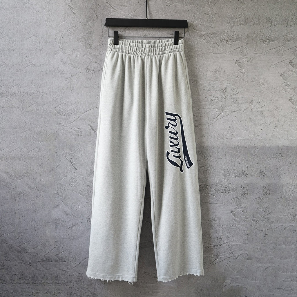 Balenciaga pants in light gray with elastic waistband and side logo patch