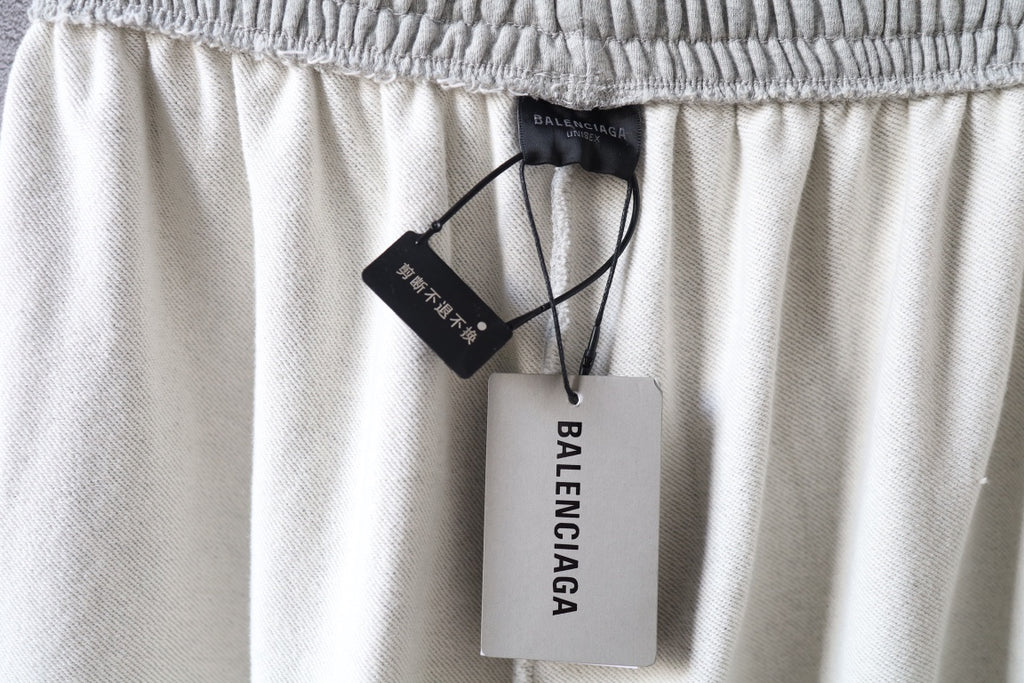 Balenciaga pants waist with hanging brand tags and elastic waistband
