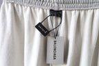 Balenciaga pants waist with hanging brand tags and elastic waistband