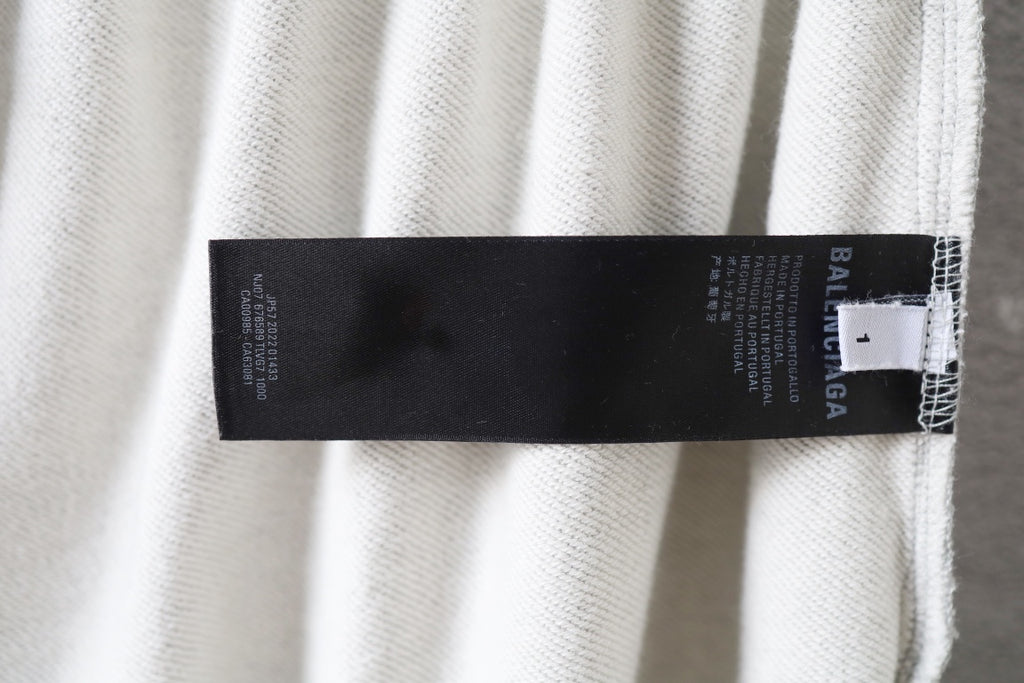 Balenciaga pants interior size label tag at waistband seam in light gray